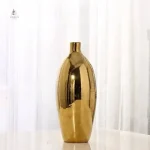 Vase doré avec silhouette stylisée et unique