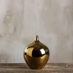 Élégant vase doré pour fleurs et plantes