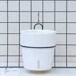 Pot de fleur avec système d'auto-arrosage