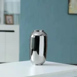Vase en métal brillant pour décoration intérieure