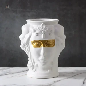 Vase décoratif en céramique avec motif visage