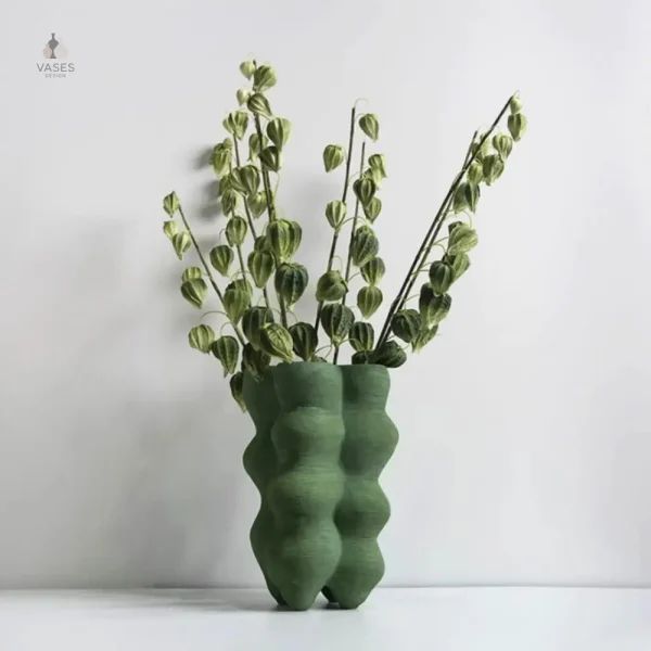 Vase design en verre vert