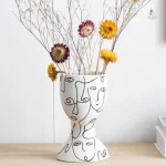 Vase visage minimaliste pour décoration intérieure