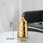 Vase décoratif doré avec texture martelée