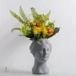Vase au design visage pour embellir votre intérieur