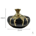 Vase noir avec ornement doré, pièce maîtresse moderne