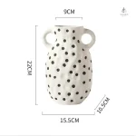 Vase avec une finition vintage, parfait pour les bouquets